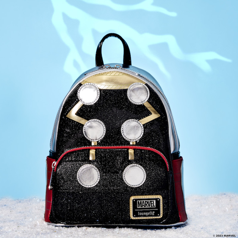 Loungefly Marvel Metallic Thor Mini Backpack that features Thor's armor on the front of the bag in metallic material, sitting against a light blue background with lightning