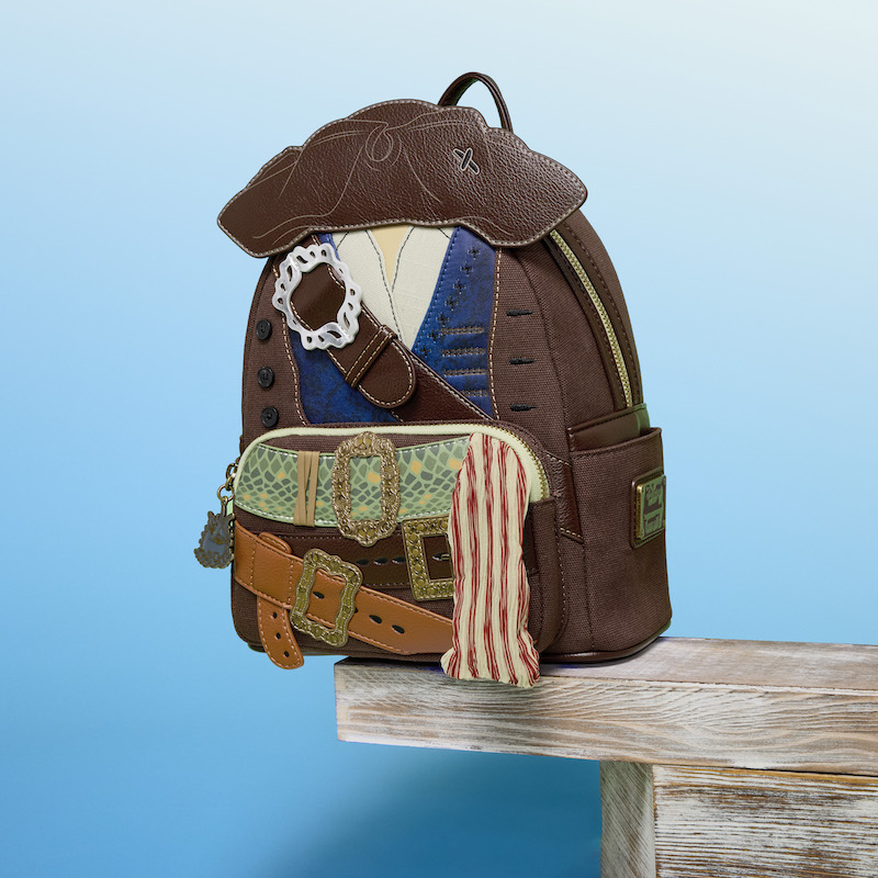 Loungefly Disney Captain Jack Sparrow mini backpack sitting on the edge of a plank against a blue background