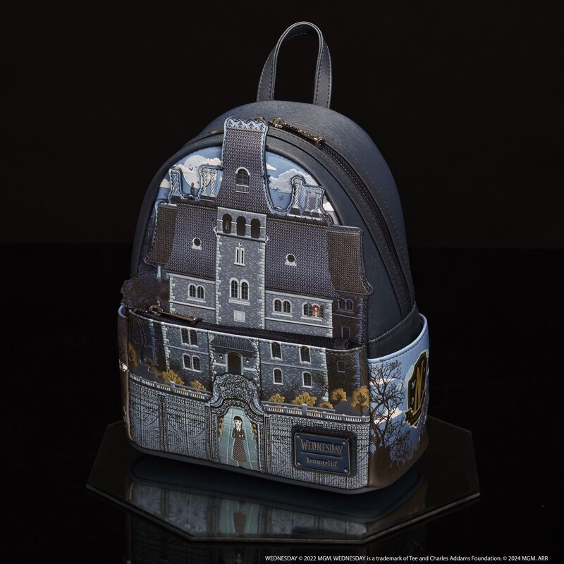 Loungefly mini backpack featuring an appliqué of Nevermore Academy on the front. It sits against a dark background.