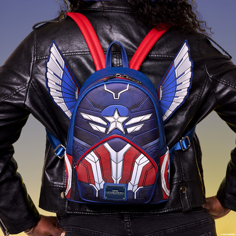 Woman facing away from camera wearing a black jacket and wearing the Loungefly Captain America: Brave New World Mini Backpack, which features retractable wings that stick out from the sides. 