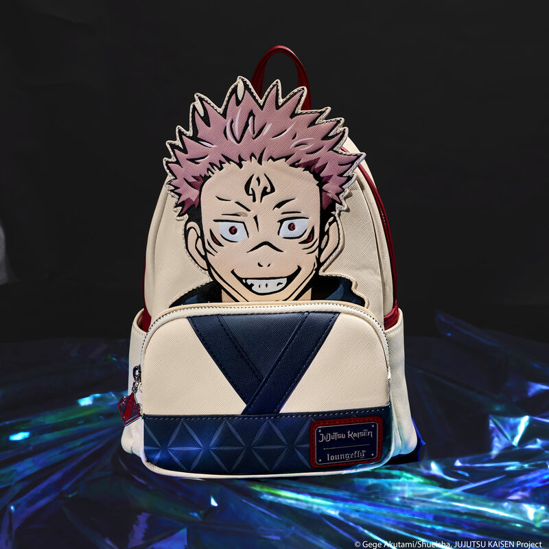 Loungefly JUJUTSU KAISEN Ryomen Sukuna Cosplay Mini Backpack sitting on an iridescent blue and green material against a black background. The back features an appliqu&eacute; of Sukuna as he takes over Yuji Itadori. 