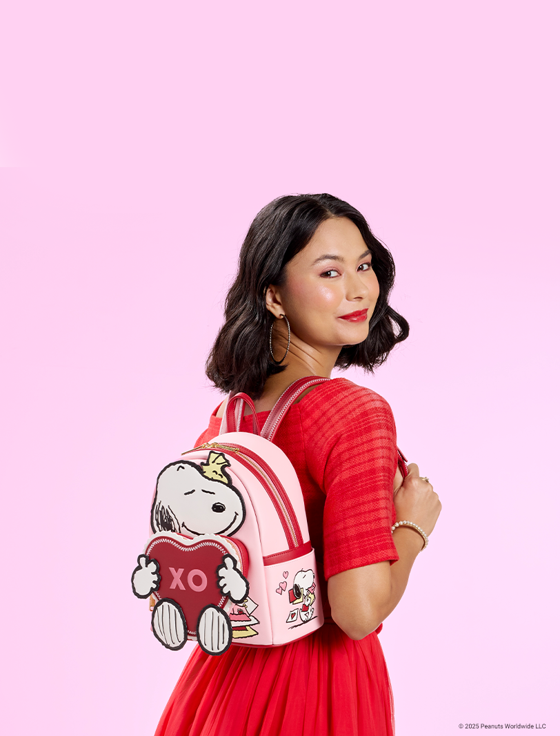 Pink background with model wearing Loungefly Peanuts Snoopy Valentine's Day collection