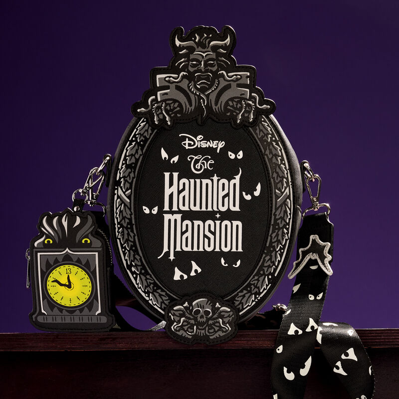 Loungefly Haunted Mansion Plaque Crossbody Bag featuring the Haunted Mansion plaque with a grandfather clock coin bag. It sits against a purple background.