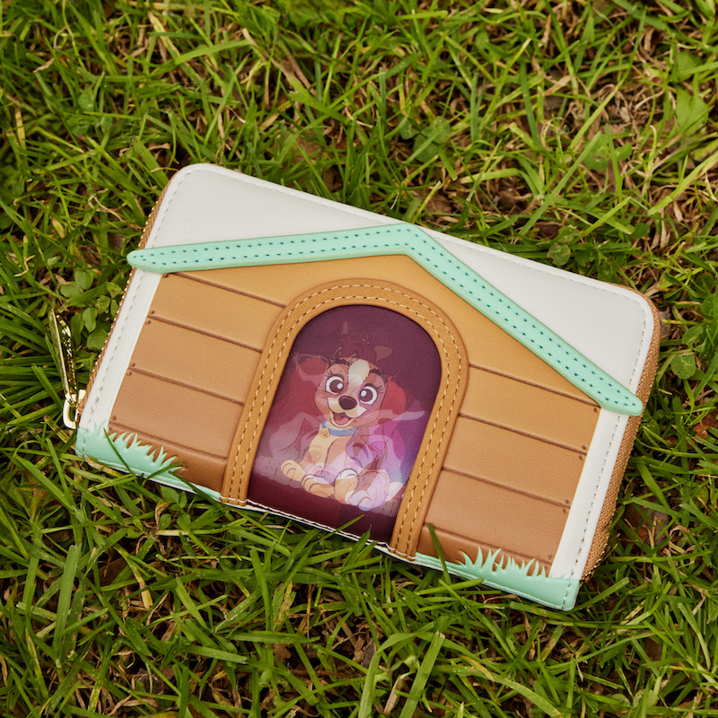 Image of the I Heart Disney Dogs Zip Around Wallet laying on the grass outside