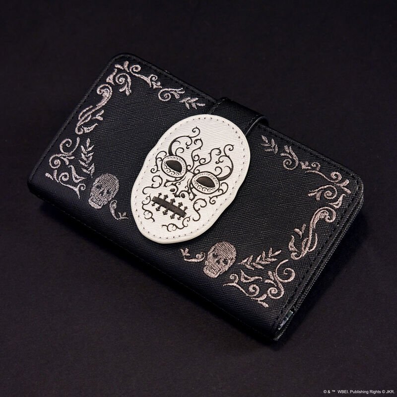 Black Loungefly Death Eater wallet featuring a silver Death Eater mask on the front surrounded by embroidered symbols. It sits against a dark background.