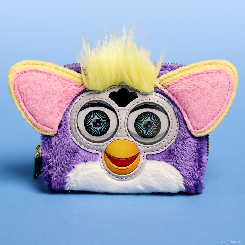 Purple plush Loungefly Furby wallet with lenticular eyes and 3D ears and yellow hair. The wallet sits against a light blue background. 