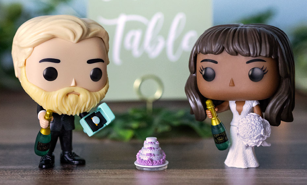 Wedding table background with 2 custom Funko POP! Yourself figures with wedding accessories