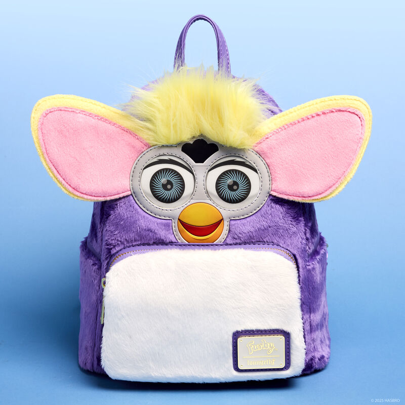 Purple plush Loungefly Furby mini backpack with lenticular eyes and 3D ears and yellow hair. The mini backpack sits against a blue background. 