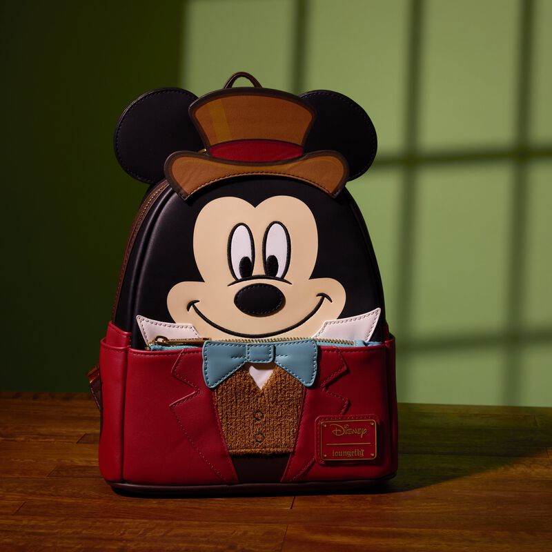 Loungefly mini backpack featuring Mickey dressed as Bob Crachit from Disney's Mickey's Christmas Carol. The bag sits against a green background. 