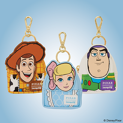 Blue background featuring Loungefly Pixar Toy Story Mystery Mini Backpack charms