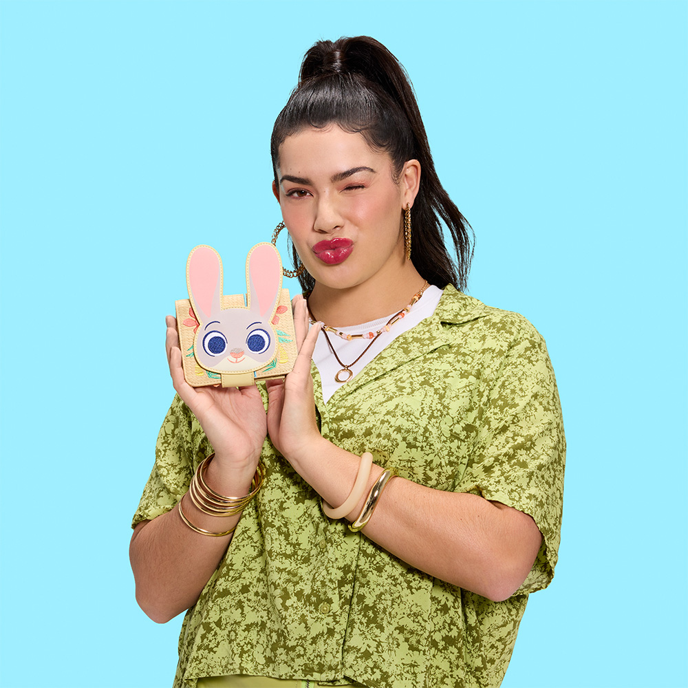 Blue background with model showcasing Loungefly Disney Zootopia wallet