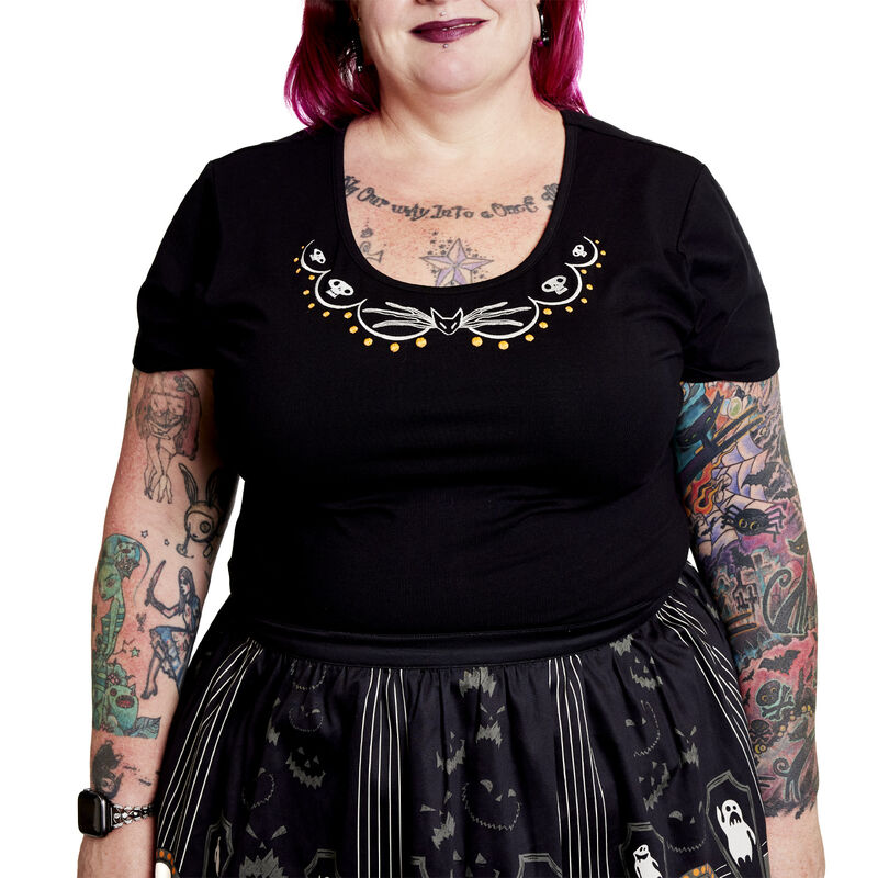 Woman against a white background wearing the Stitch Shoppe Nightmare Before Christmas Kelly Top and Sandy Skirt