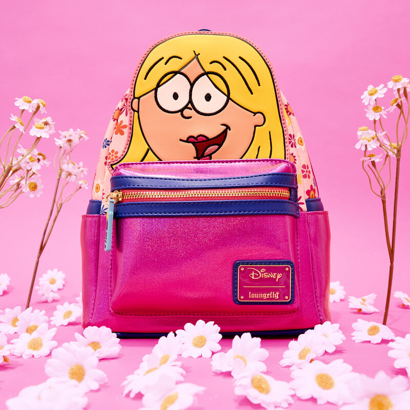 Metallic pink Loungefly mini backpack with an appliqué of the animated version of Lizzie McGuire on the front. The bag sits against a pink background surrounded by daisies