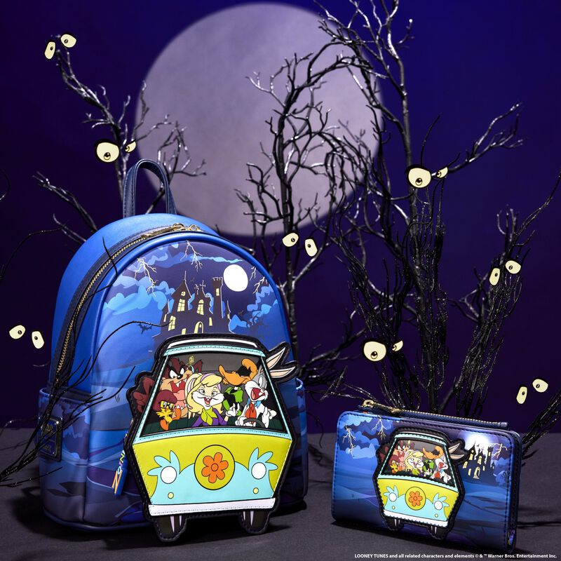 Image of the WB 100 Looney Tunes Scooby-Doo mashup collection, featuring Looney Tunes characters dressed as the Scooby-Doo characters in the mystery machine against a spooky background featuring a full moon and bare trees with eyes 