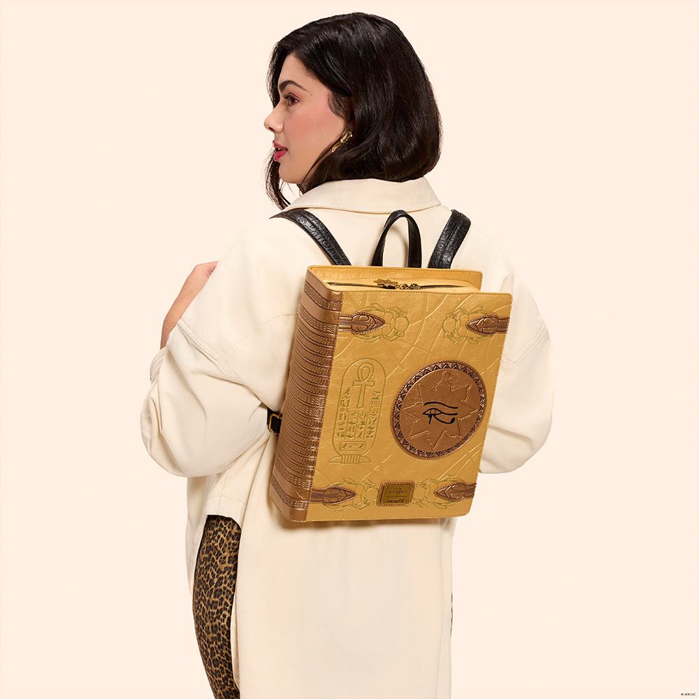 Tan background with model wearing Loungefly Universal The Mummy Mini Backpack