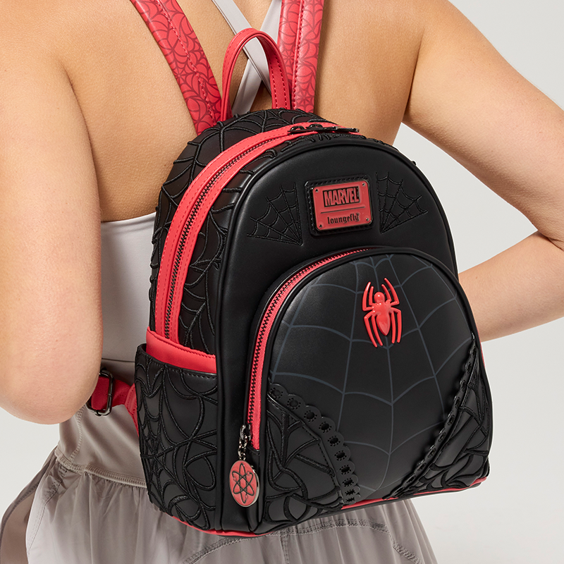 Gray background with model wearing Loungefly Marvel Spider-Man mini backpack