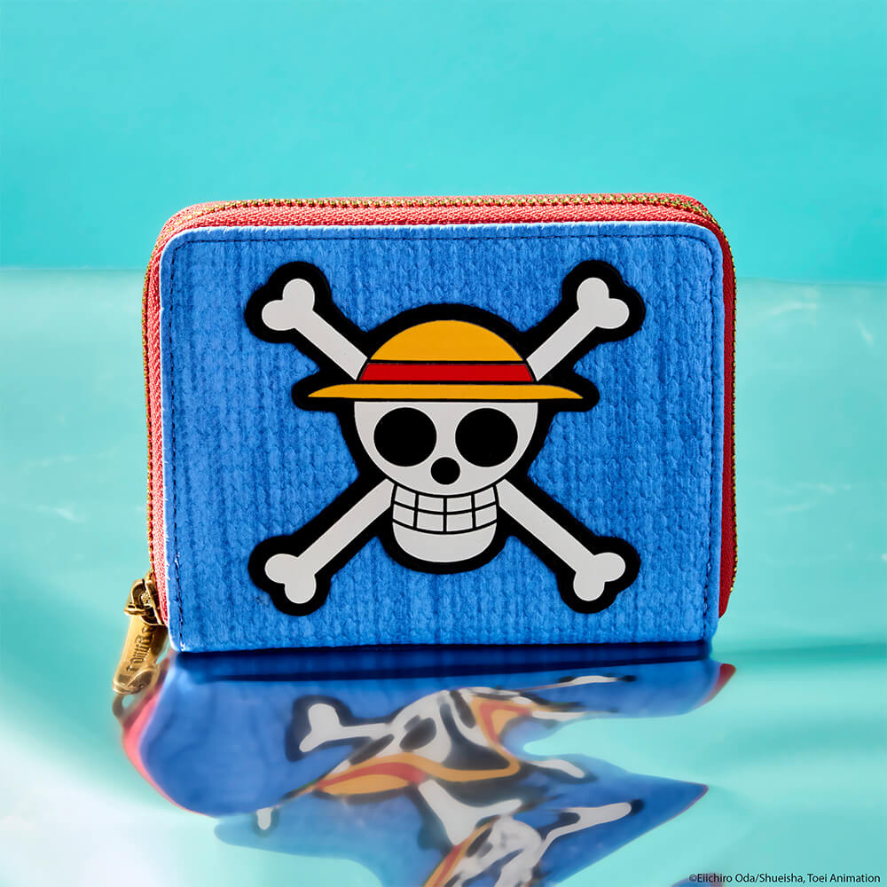 Blue product background with reflective surface featuring NYCC Exclusive One Piece Luffy Skull Zip Around Wallet