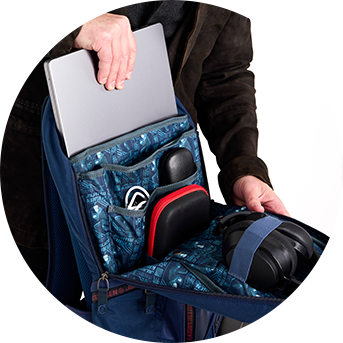 Model opening Loungefly COLLECTIV Jujutsu Kaisen The GAMR Full-Size Backpack with organized interior compartments