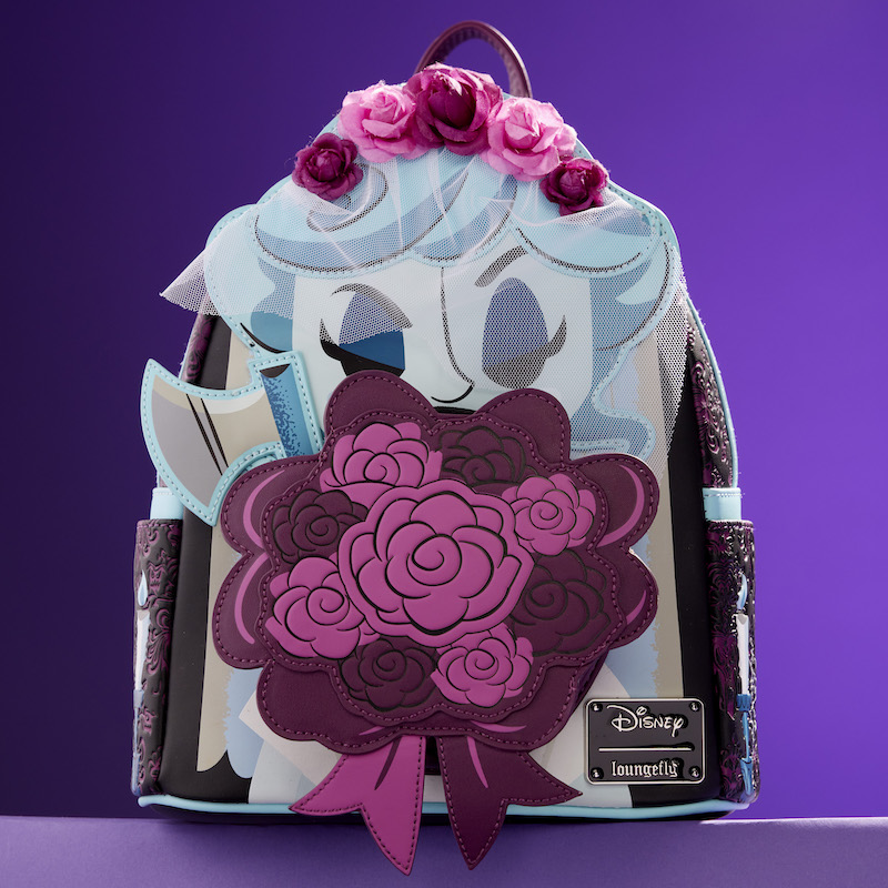 Loungefly cosplay mini backpack featuring the Black Widow Bride from The Haunted Mansion holding a bouquet of flowers and an axe. She has a veil over her face. The bag sits against a purple background. 