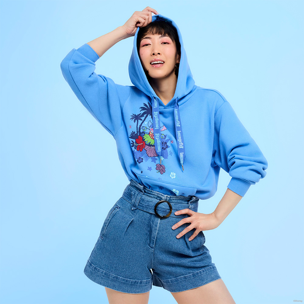 Blue background with model wearing Loungefly Disney Stitch apparel