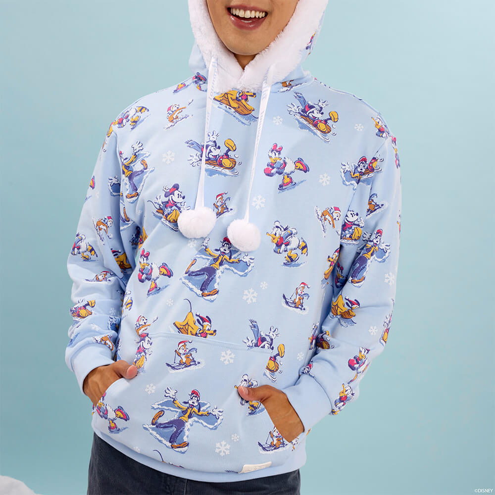 Blue product background with male model featuring Disney Mickey & Friends Winter Wonderland Unisex Hoodie