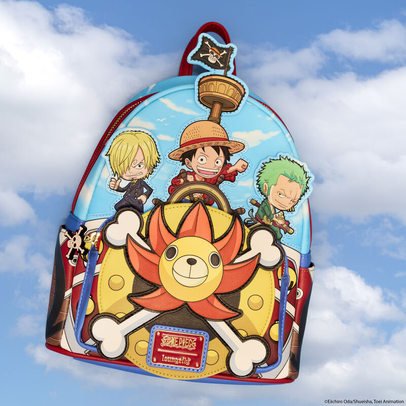 Loungefly One Piece mini backpack featuring Luffy, Sanji, and Zoro at the helm of the Thousand Sunny. The backpack sits against a light blue cloudy sky background. 