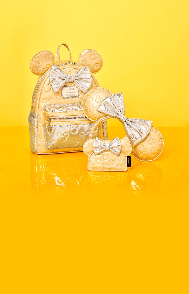 Yellow Gold product background with reflective surface showcasing Loungefly exclusive Disney Minnie Mouse Quilted collection