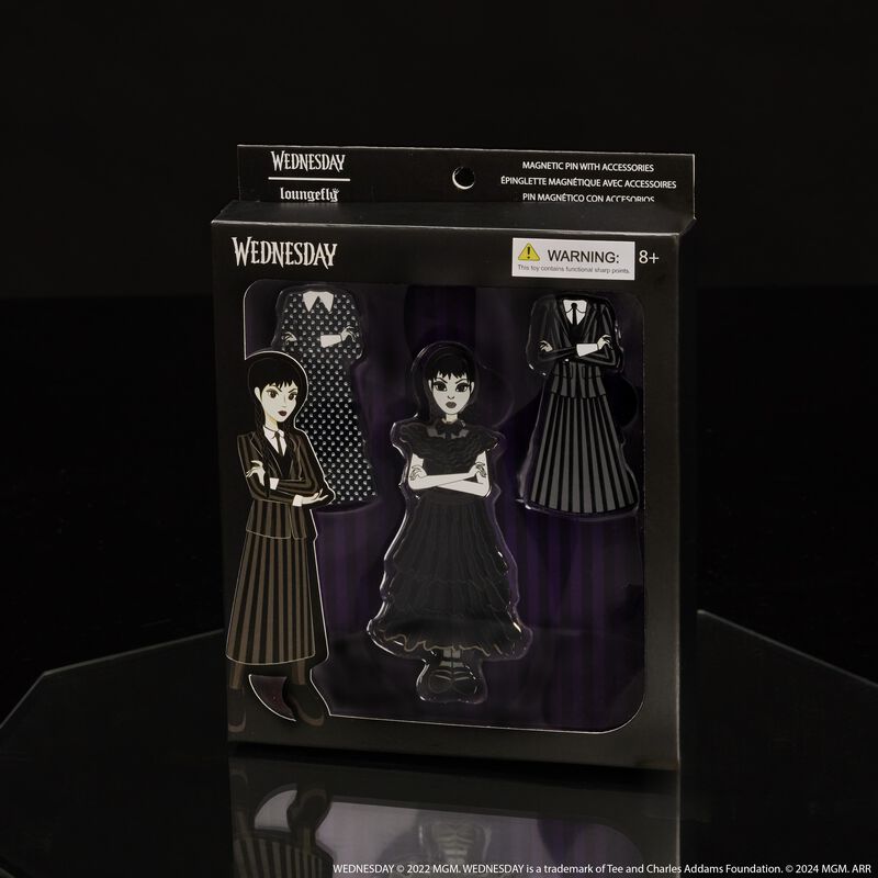 Loungefly Wednesday Addams Paper Doll Pin Set, featuring Wednesday Addams with three dress options to swap whenever. It sits against a dark background. 