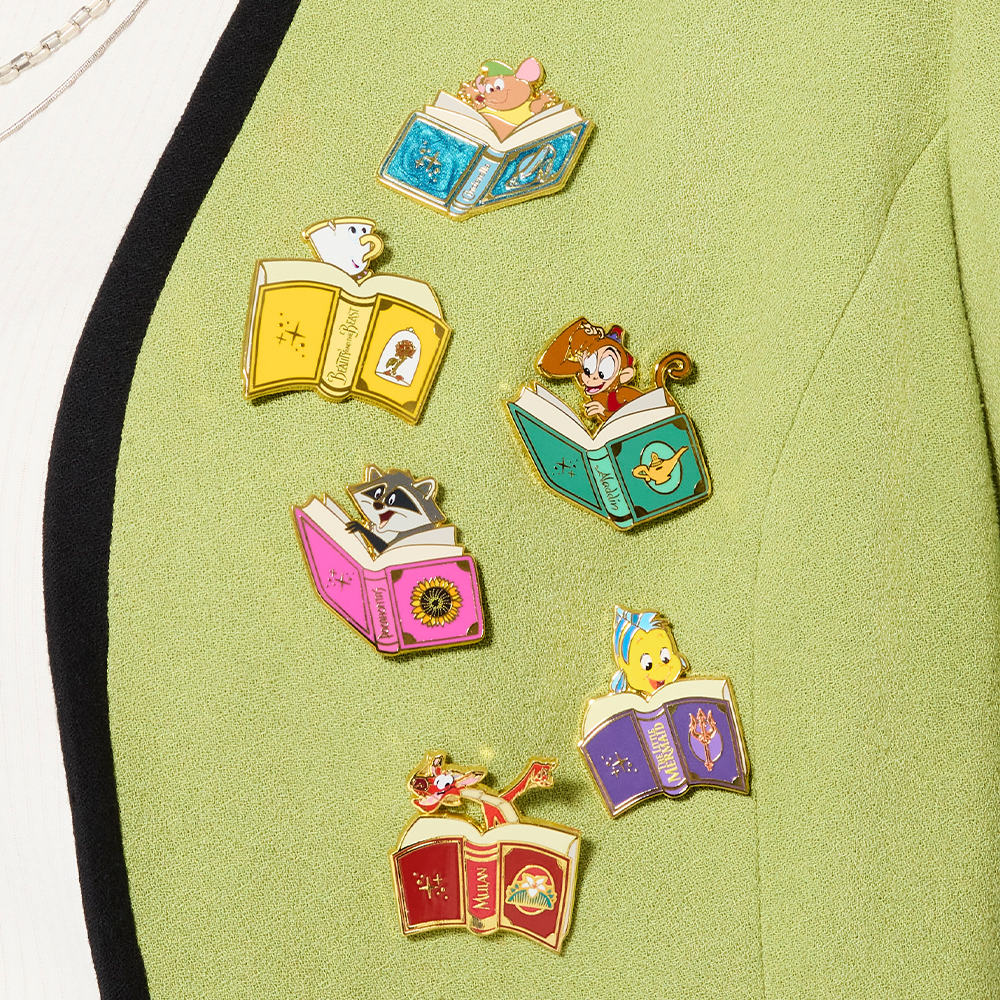 Close-up of Green sweater featuring Loungefly Disney Sidekicks pins